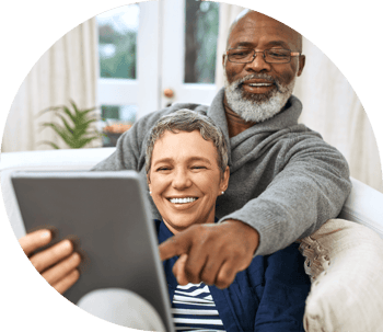 Smiling couple looking at a tablet